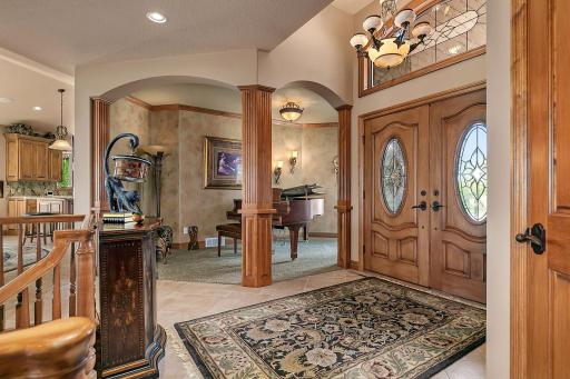 Front foyer is all the more decadent with a formal sitting room or as this seller utilizes as a dedicated music room.