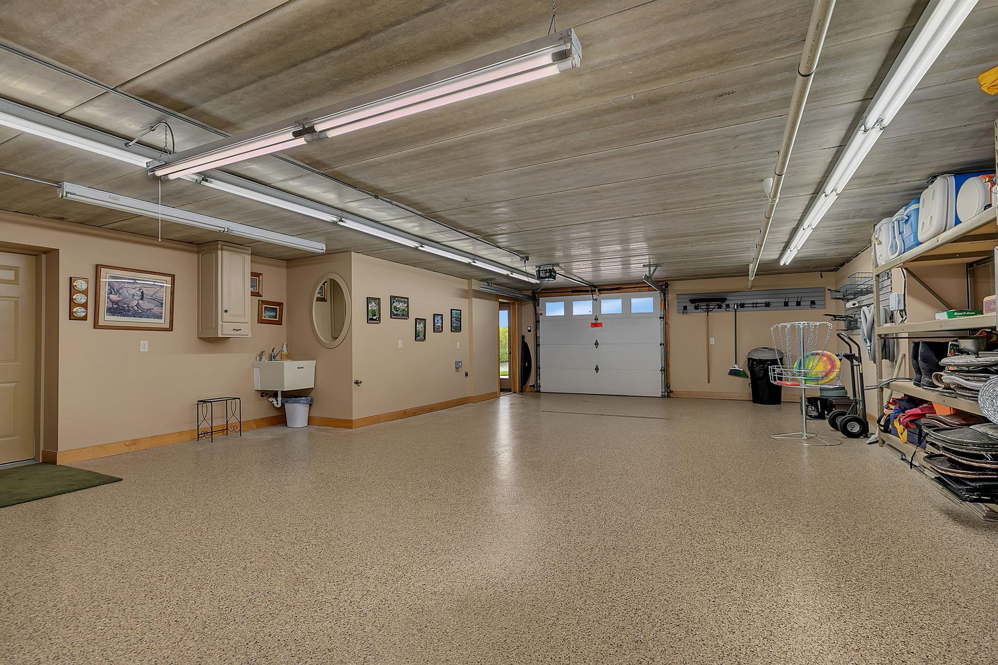 Walks out to your backyard retreat and lends direct access into the home. Tuck under garage is so dynamic for use. Water toys, overflow seating, art studio, play area in the winter. Heated, insulated and full finished. Utility sink too.