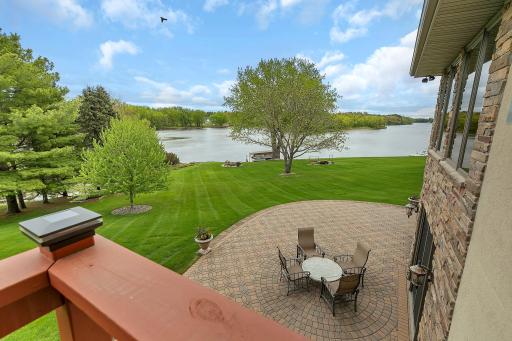 Looks over the wrap around patio and backyard oasis.