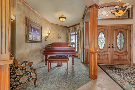 Front formal sitting room is effective for this baby grand.