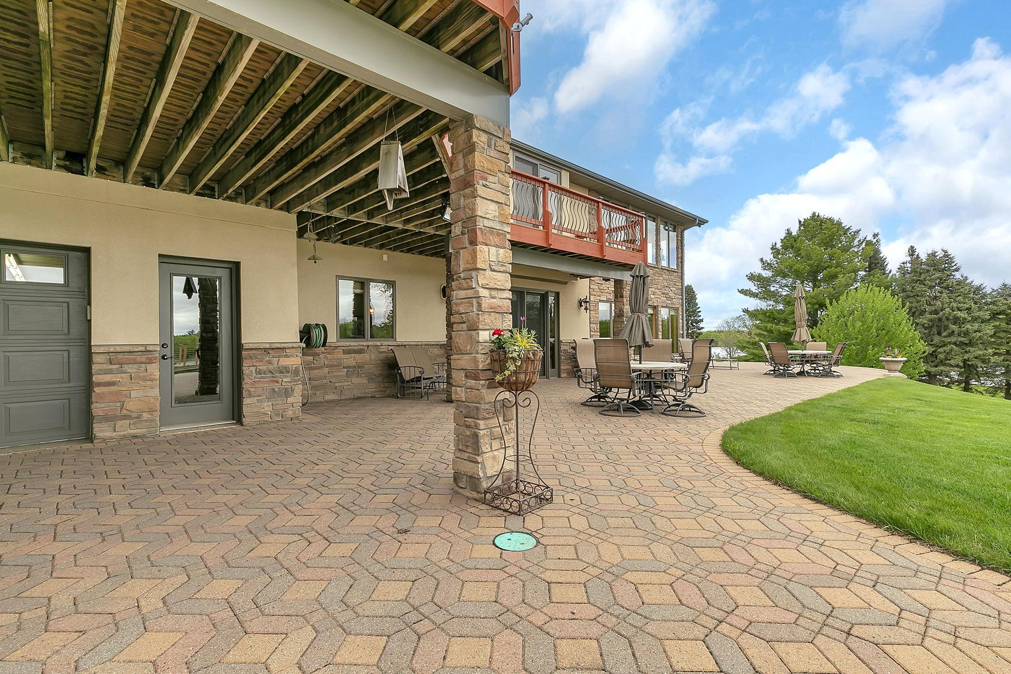 Door lends access into tuck under garage, upper level garage, and lower level living.