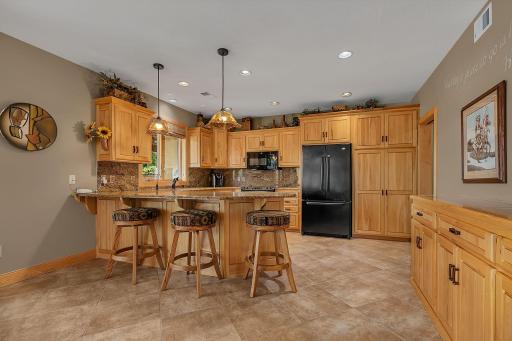 Appreciate the full kitchen in the lower level. Full buffet along the interior wall for storage and all the snack and goodies.