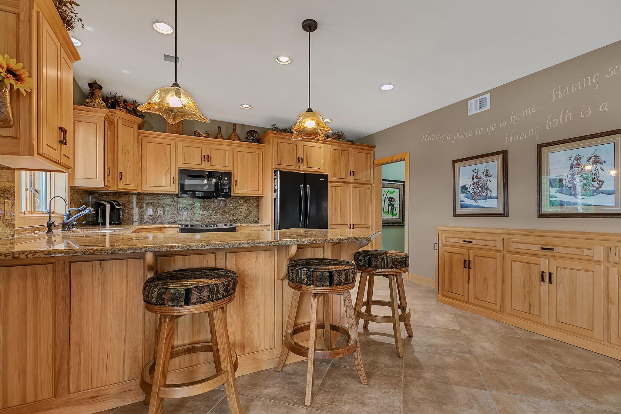 Fully equipped lower level kitchen is great for multigenerational living situations as well.