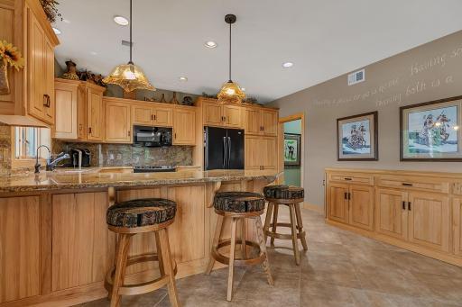Fully equipped lower level kitchen is great for multigenerational living situations as well.