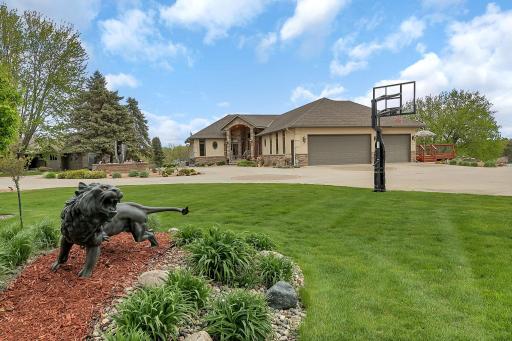 Garden statue adds visual interest and charm to the outdoor space.