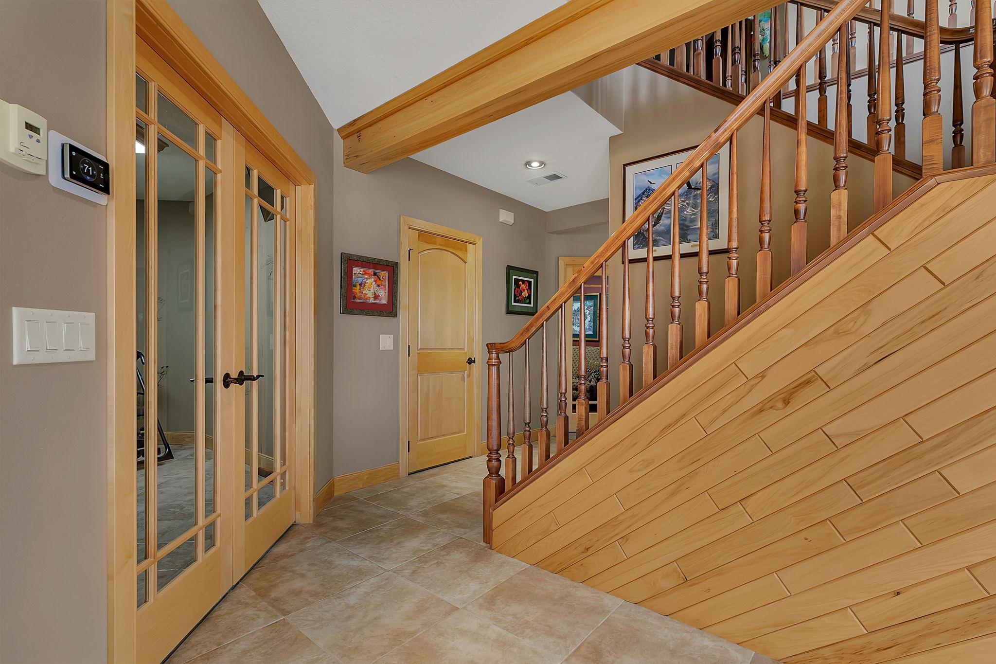 Open stairwell to the upper level allows for more natural light.