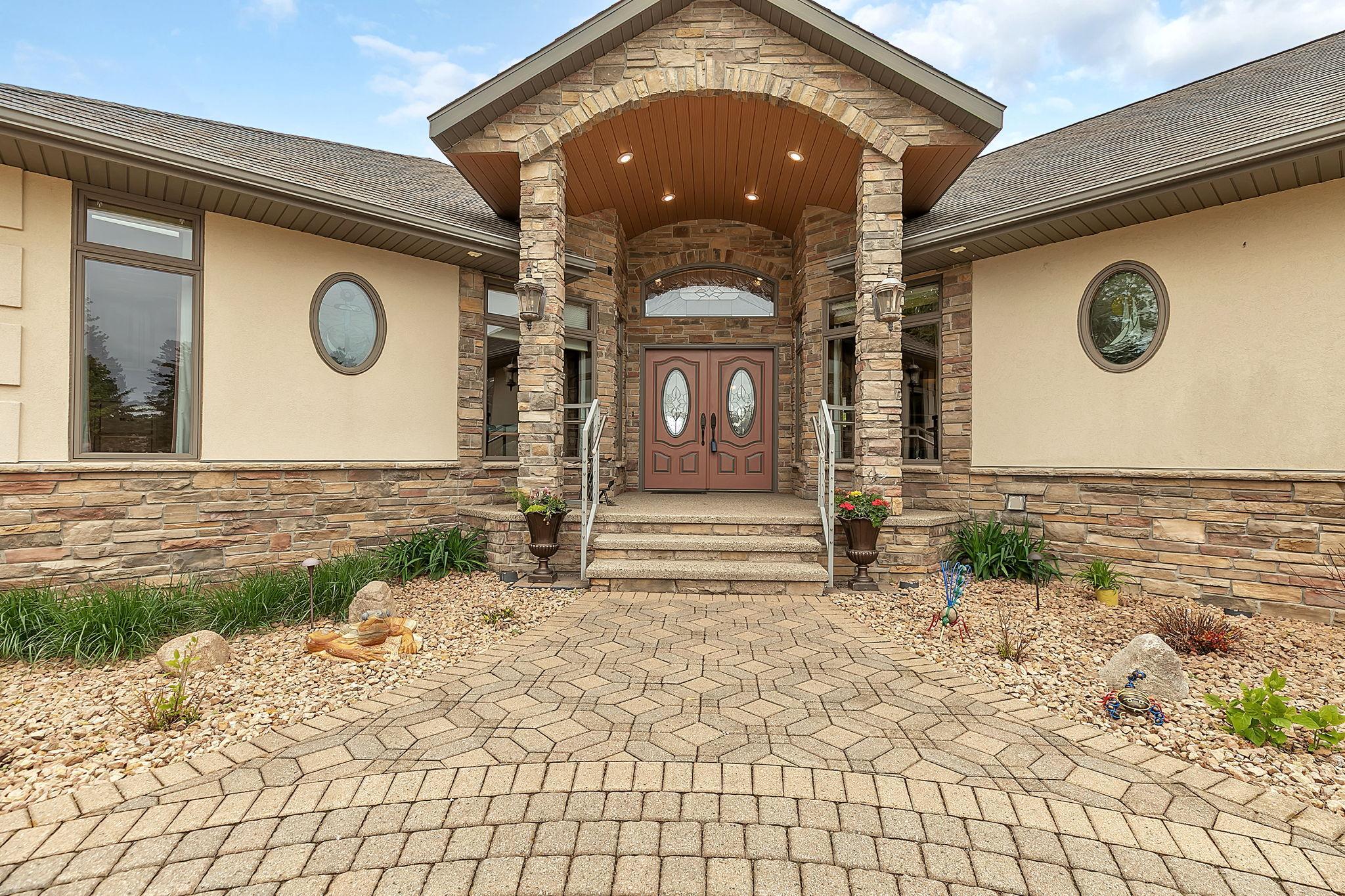 Sets the tone of the home, grand entrance, mature landscape, unique artwork and stain glass windows.