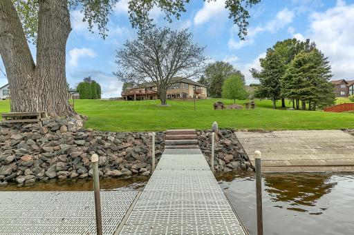 Dock will stay, and enjoy your own personal concrete access. Large tree makes for shade over your boat in between rides.