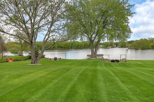 Private dock completes the ultimate riverfront living experience. Notice one of the islands on this stretch of river in this photo. Great sand bar here where people gather to swim.