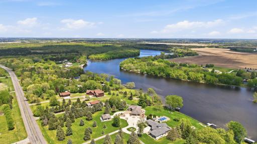 Aerial views capture stunning riverfront scenery and water access.