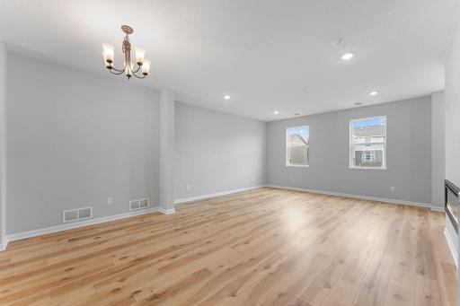 View from dining area to family room. Similar home shown, options can vary.
