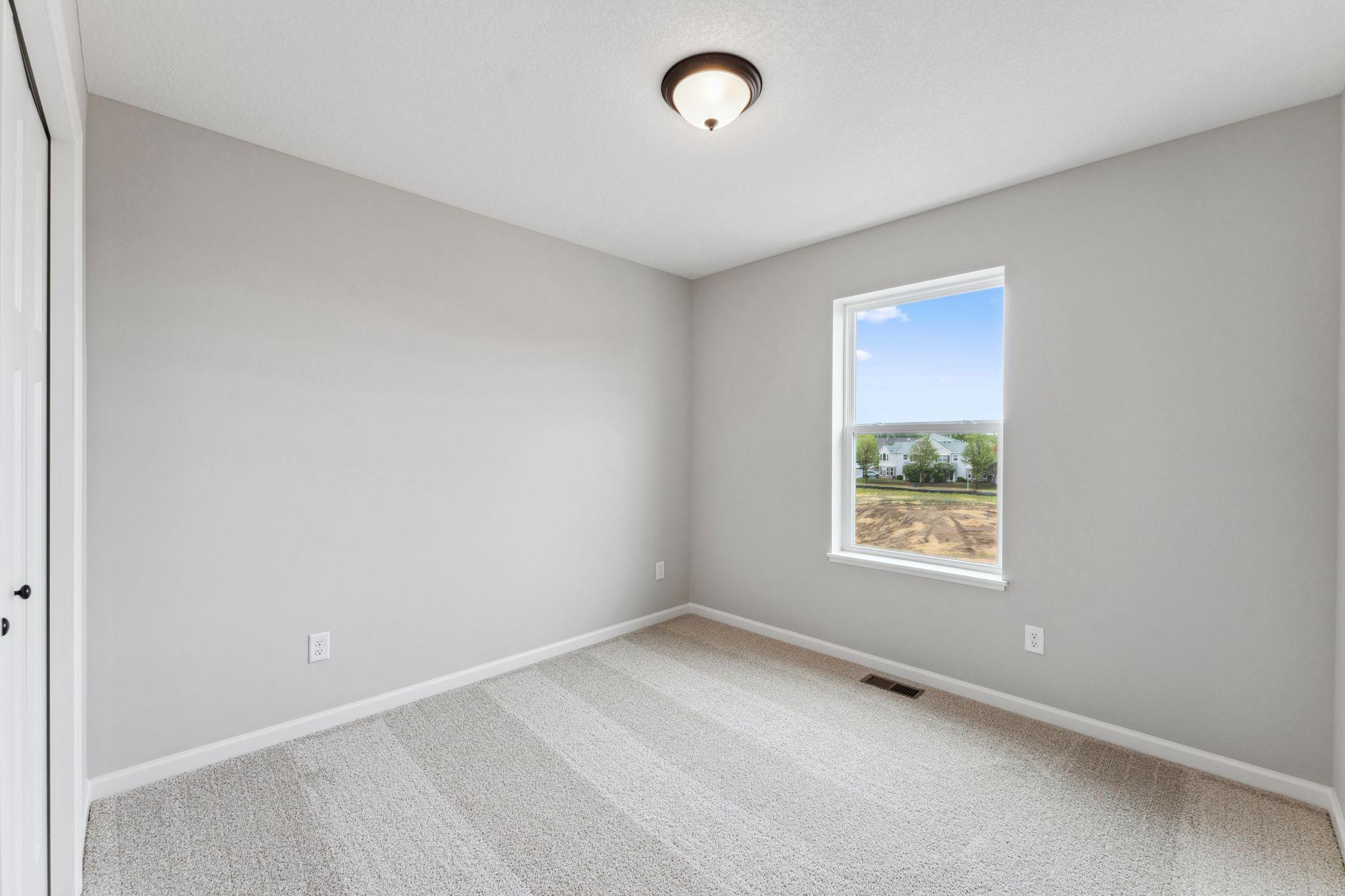 Secondary bedroom. Similar home shown.