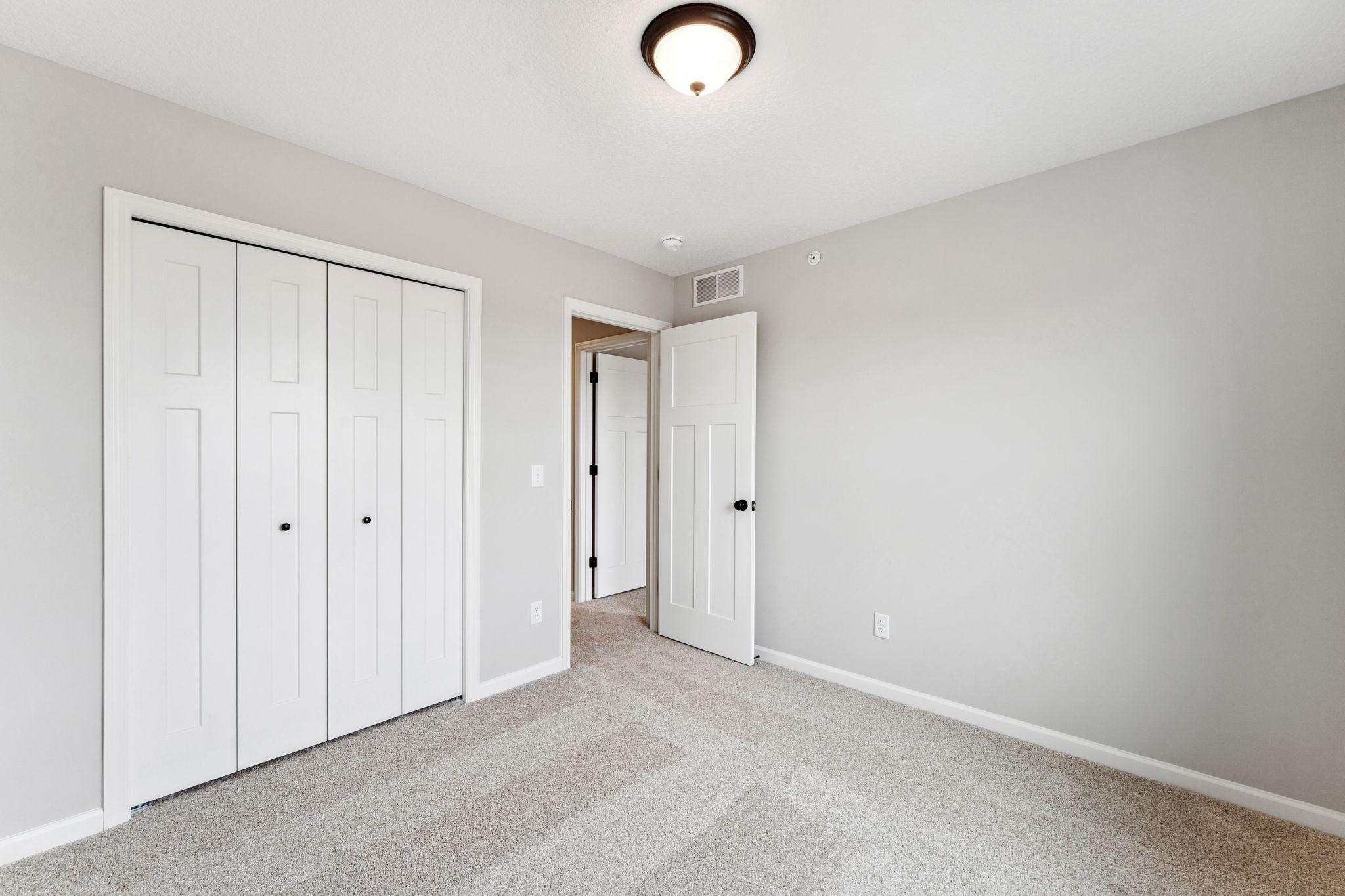 Secondary bedroom. Similar home shown.