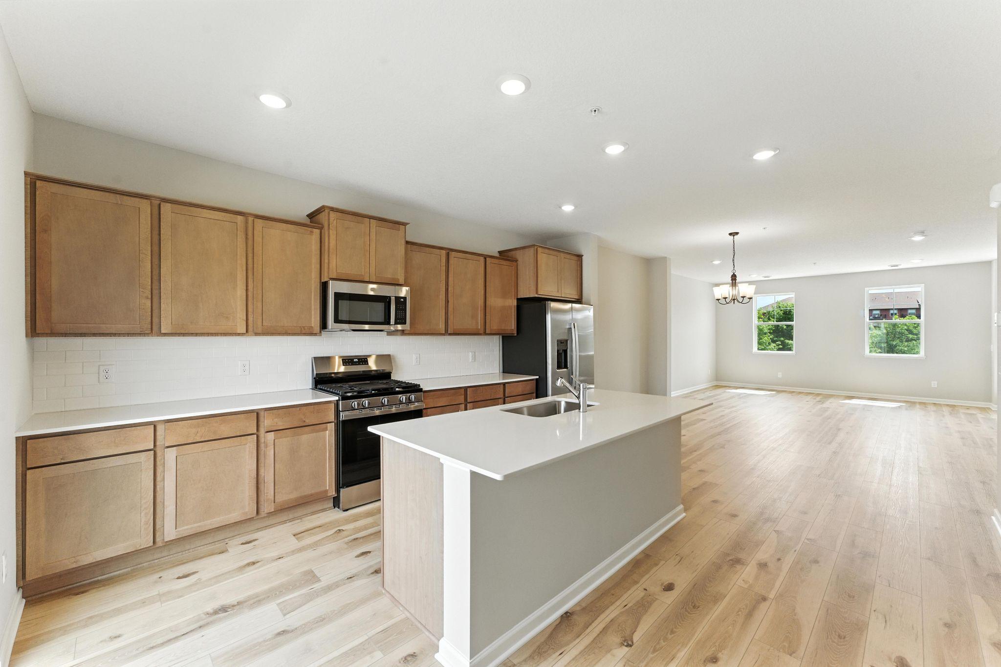 Functional flow and tons of surface space makes cooking and entertaining a breeze. Similar home shown, color and options can vary.