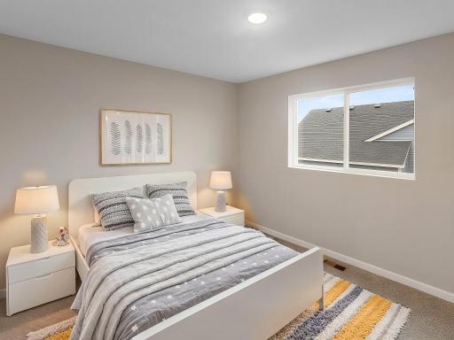 Bedroom 2, Virtually Staged. Photo taken of another home with similar plan and finishes. Photos and renderings may not depict actual plan, materials, & finishes may vary. All measurements are approximate.