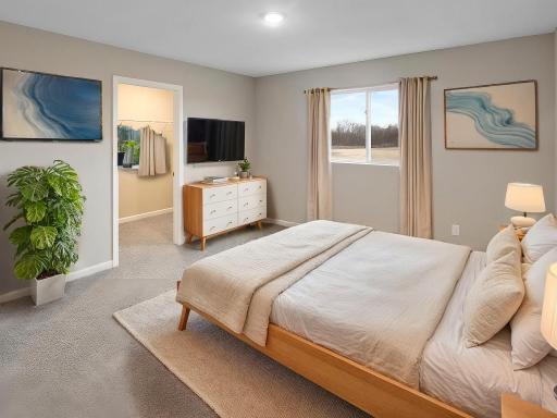 Primary Suite, Virtually Staged. Photo taken of another home with similar plan and finishes. Photos and renderings may not depict actual plan, materials, & finishes may vary. All measurements are approximate.