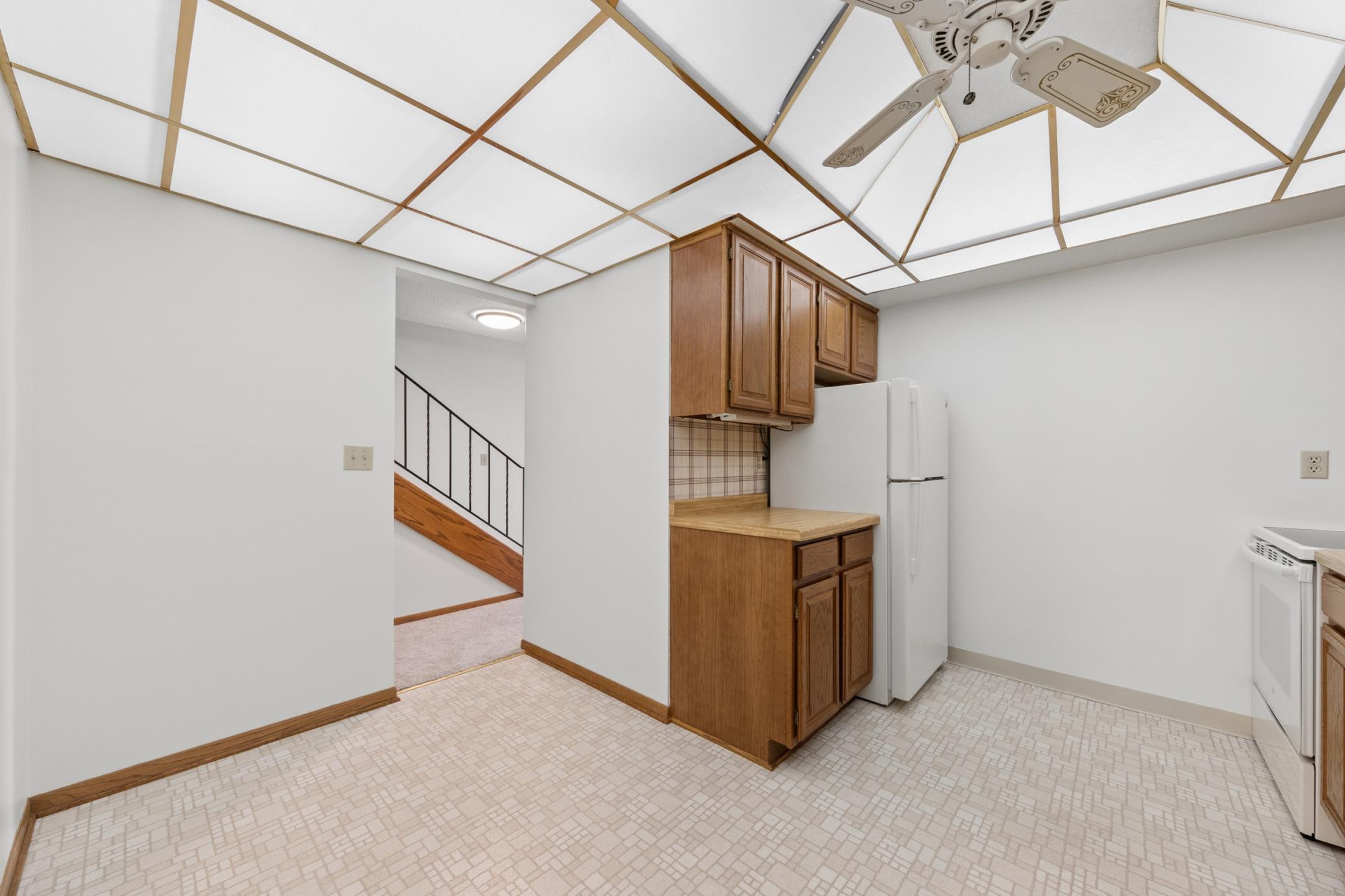 Informal, eat in kitchen with lots of cupboards & storage space.