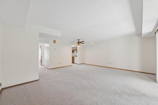 New carpet & paint throughout (2026), open concept living room & dining room space. Lots of natural sunlight, walkout level through oversized sliding glass door to backyard. Personal landscaping touches and bird feeders in back.