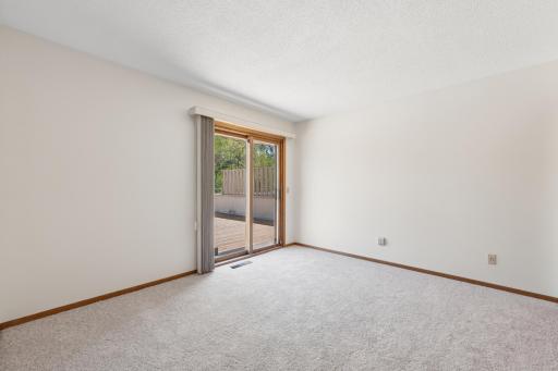 Secondary bedroom with sliding glass door leading out to large deck (21x19.4)