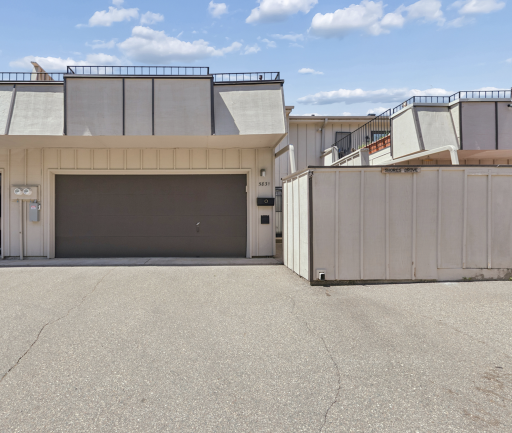 Primary front photo of property, 2 car garage with large deck (21x19.4), private entry to front door.