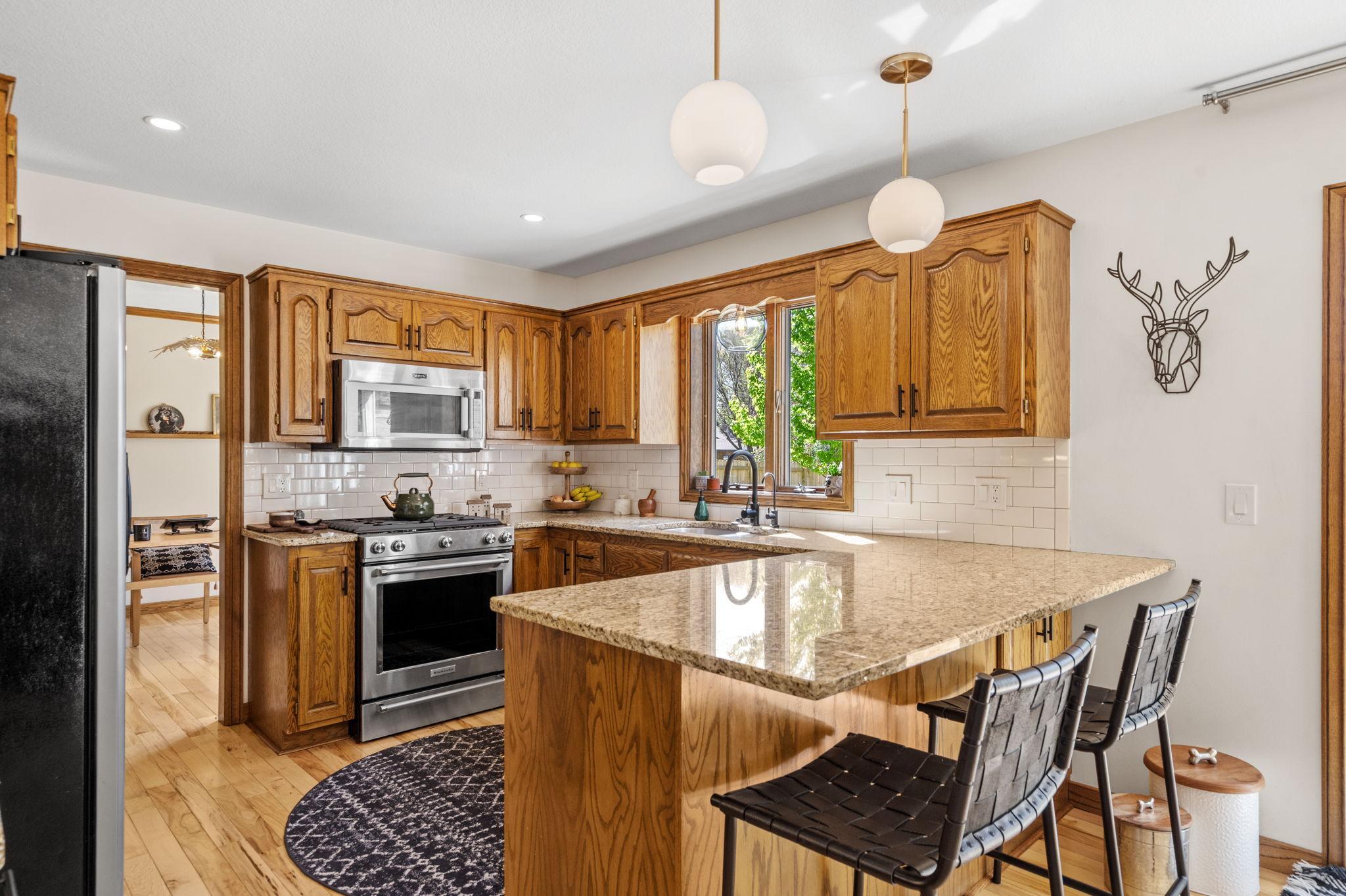 Spacious Kitchen w/ New Appliances, Upgraded Hardware, Solid Wood Cabinetry, and Granite Countertops