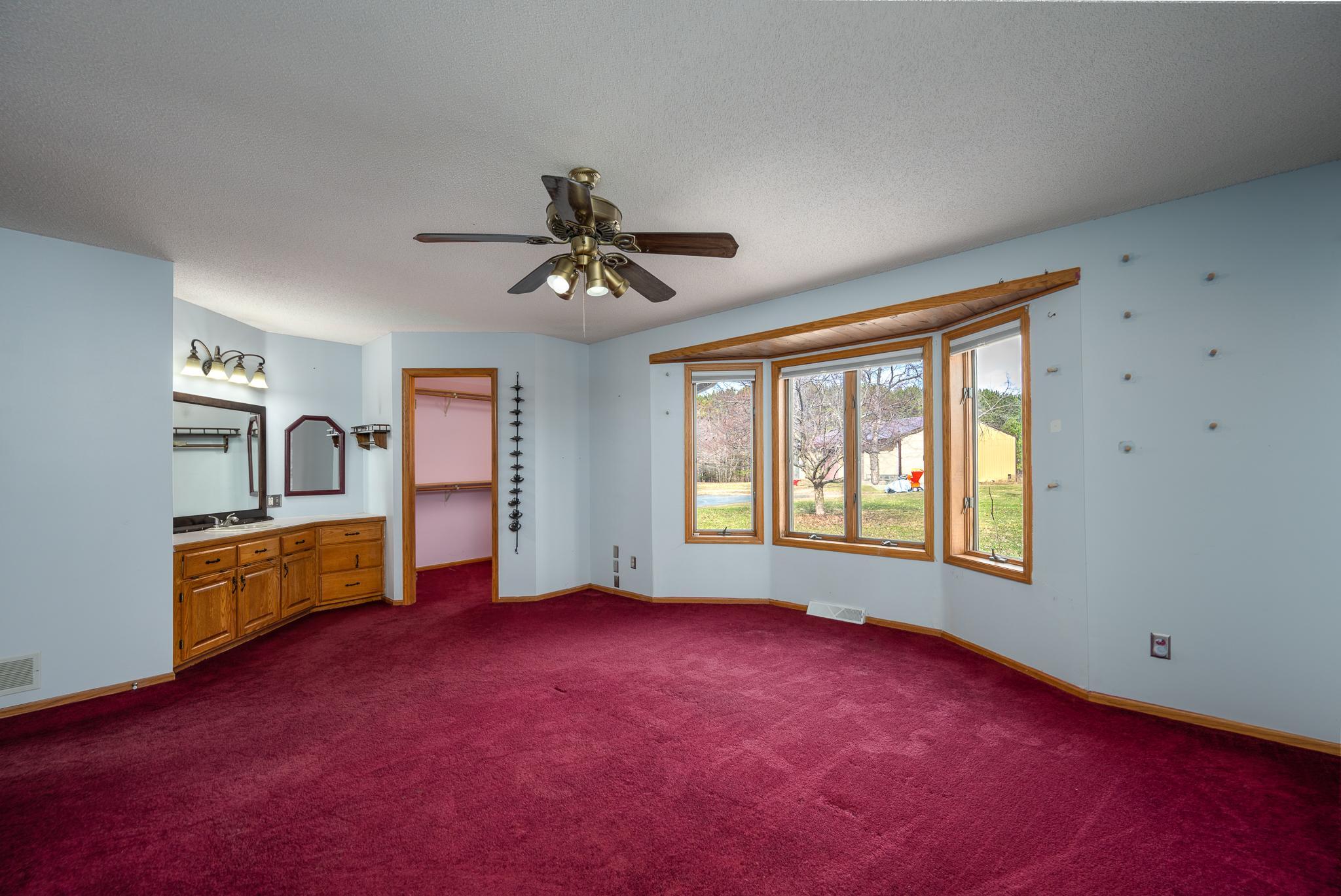 Includes a walk in closet and vanity