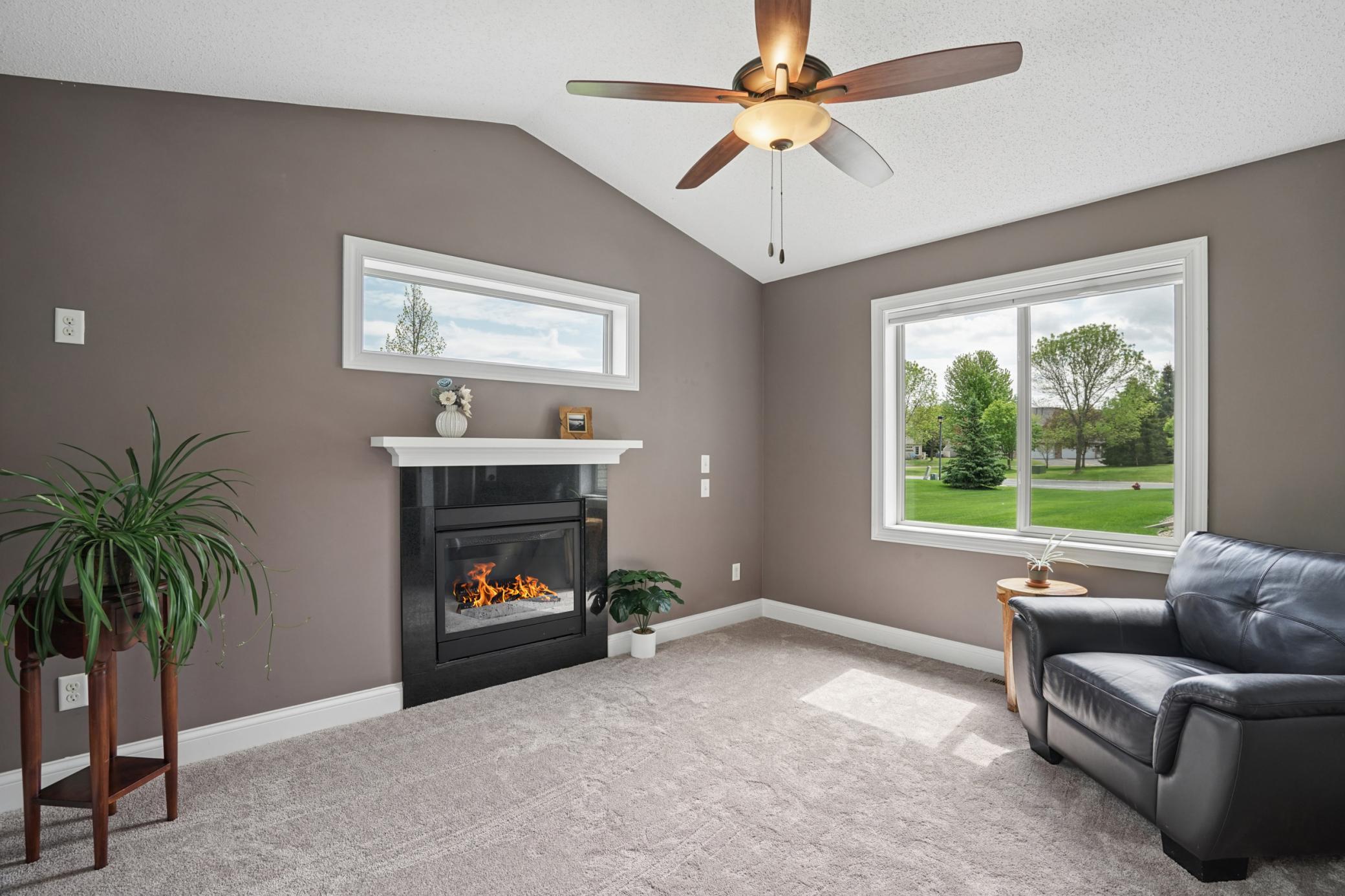 Sun room features cozy gas fireplace