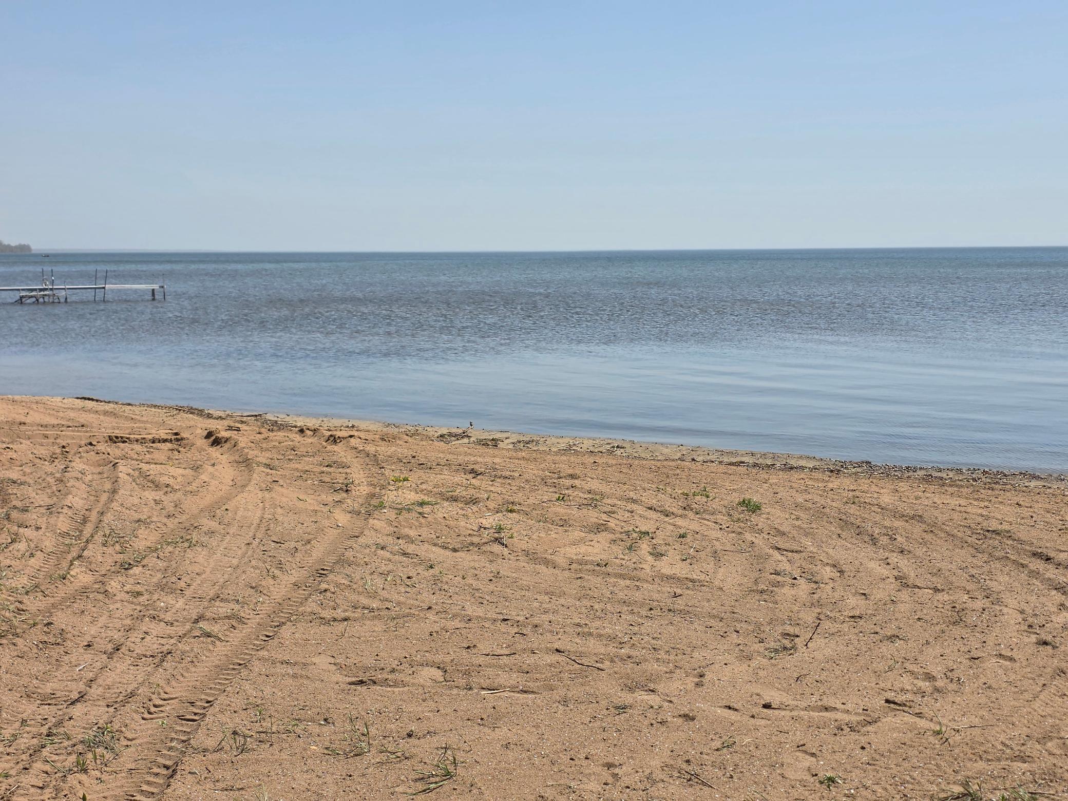 Sandy beach steps from your door!