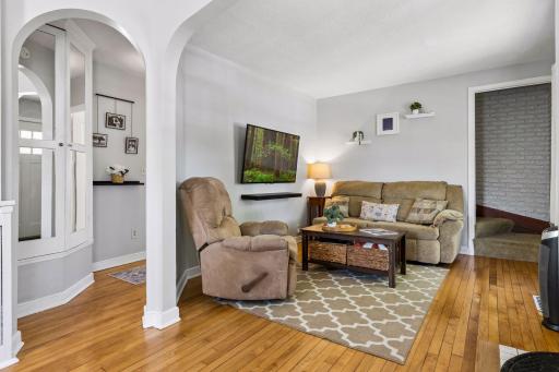 Main level features arches and hardwood floors