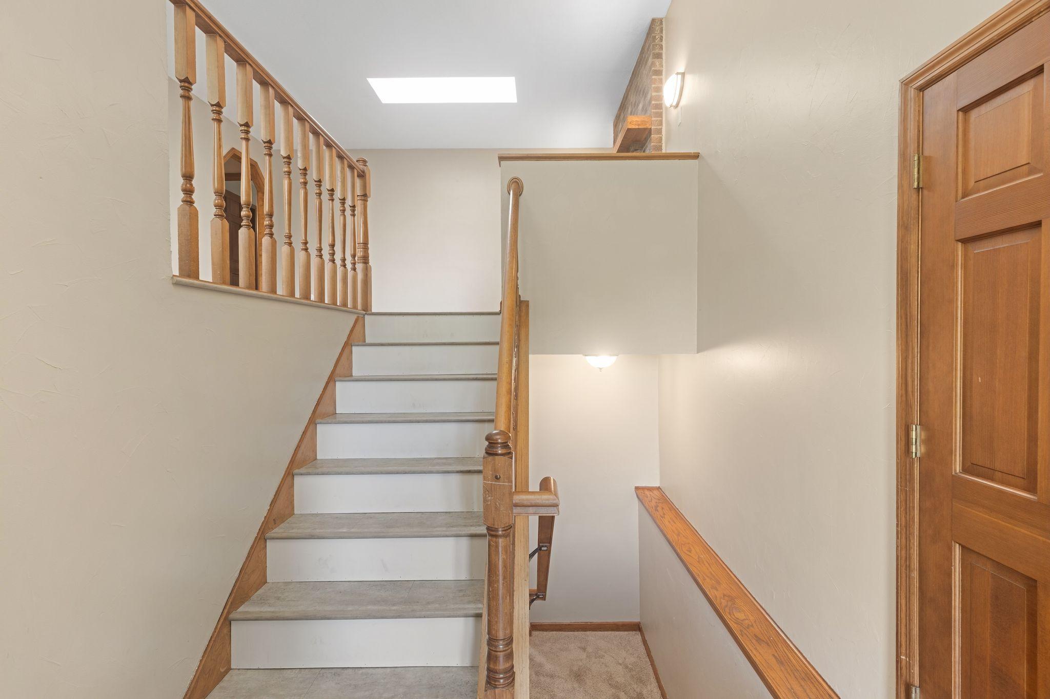 The foyer steps to the upstairs or lower level.
