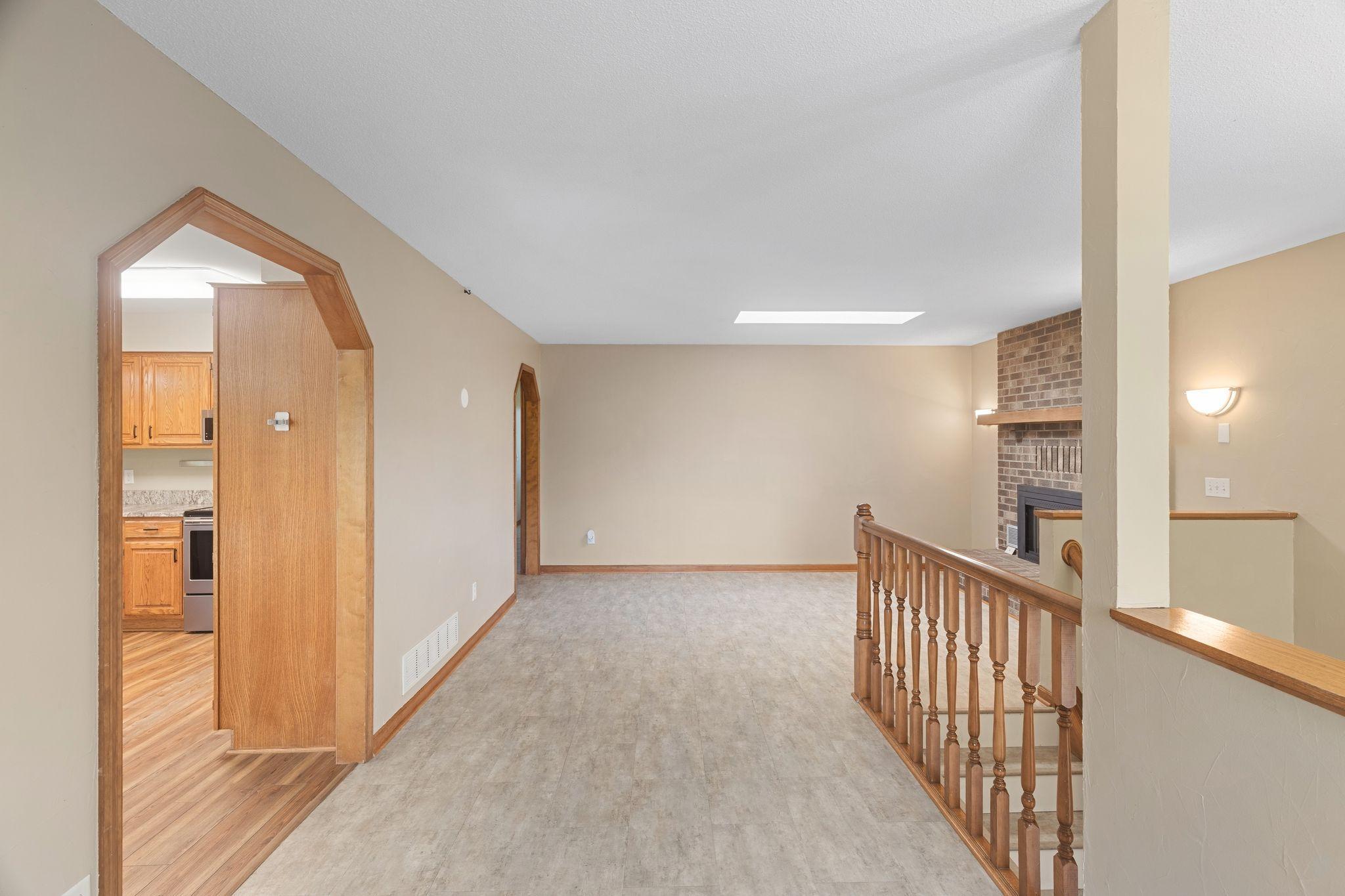 The living room features a sky light letting in lots of sunshine!