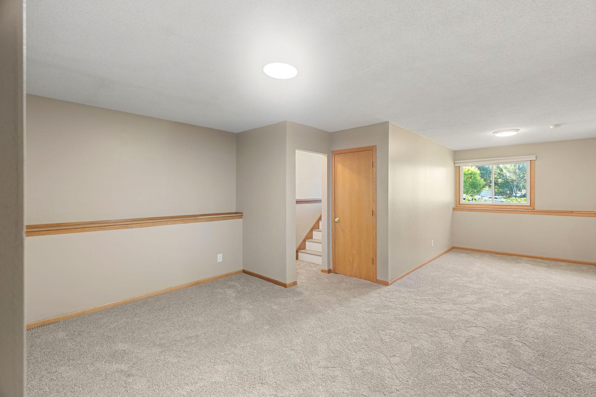 The lower level family room is bright and spacious.