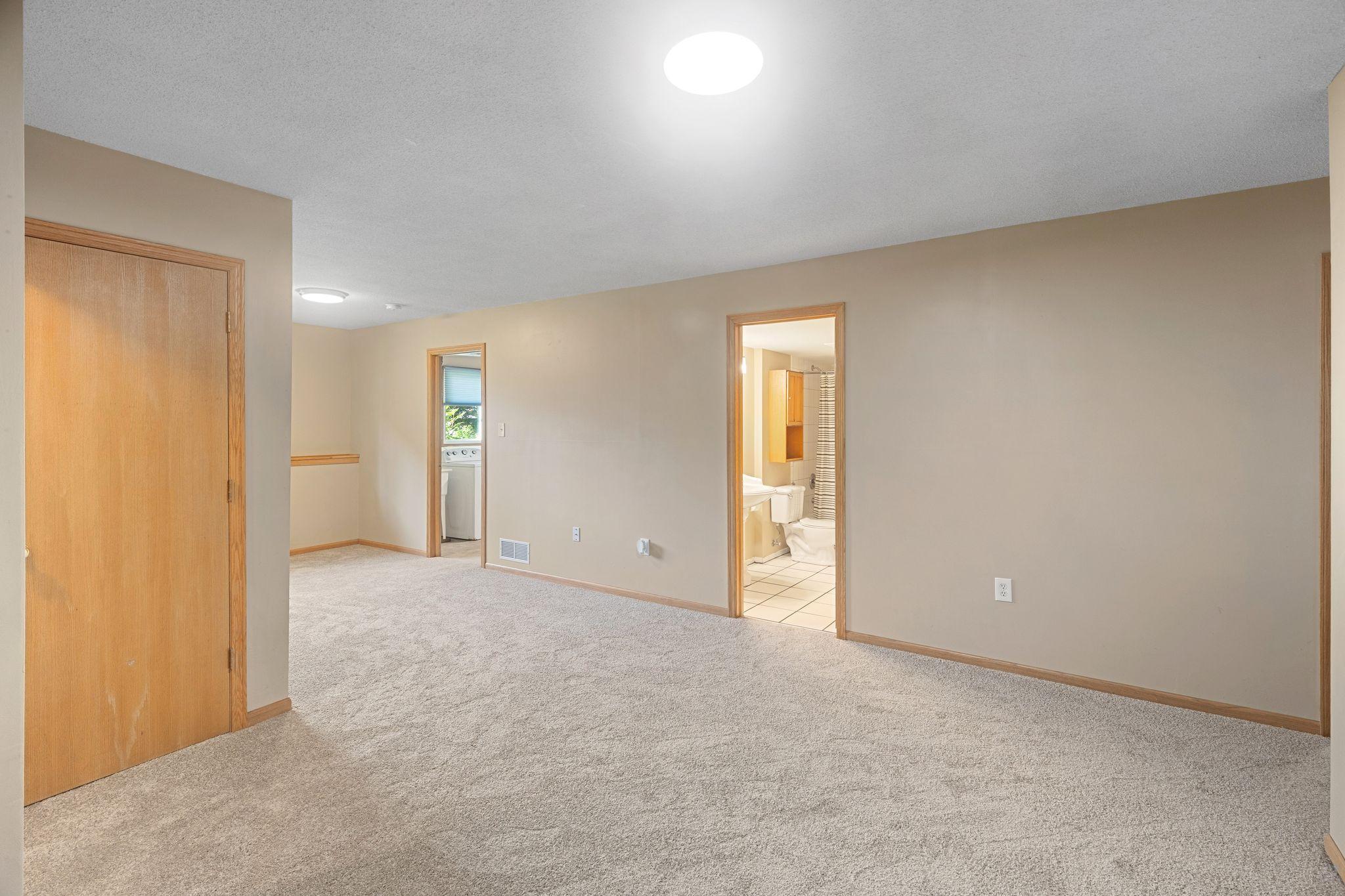 The utility/laundry room and lower level full bath are adjacent to the family room