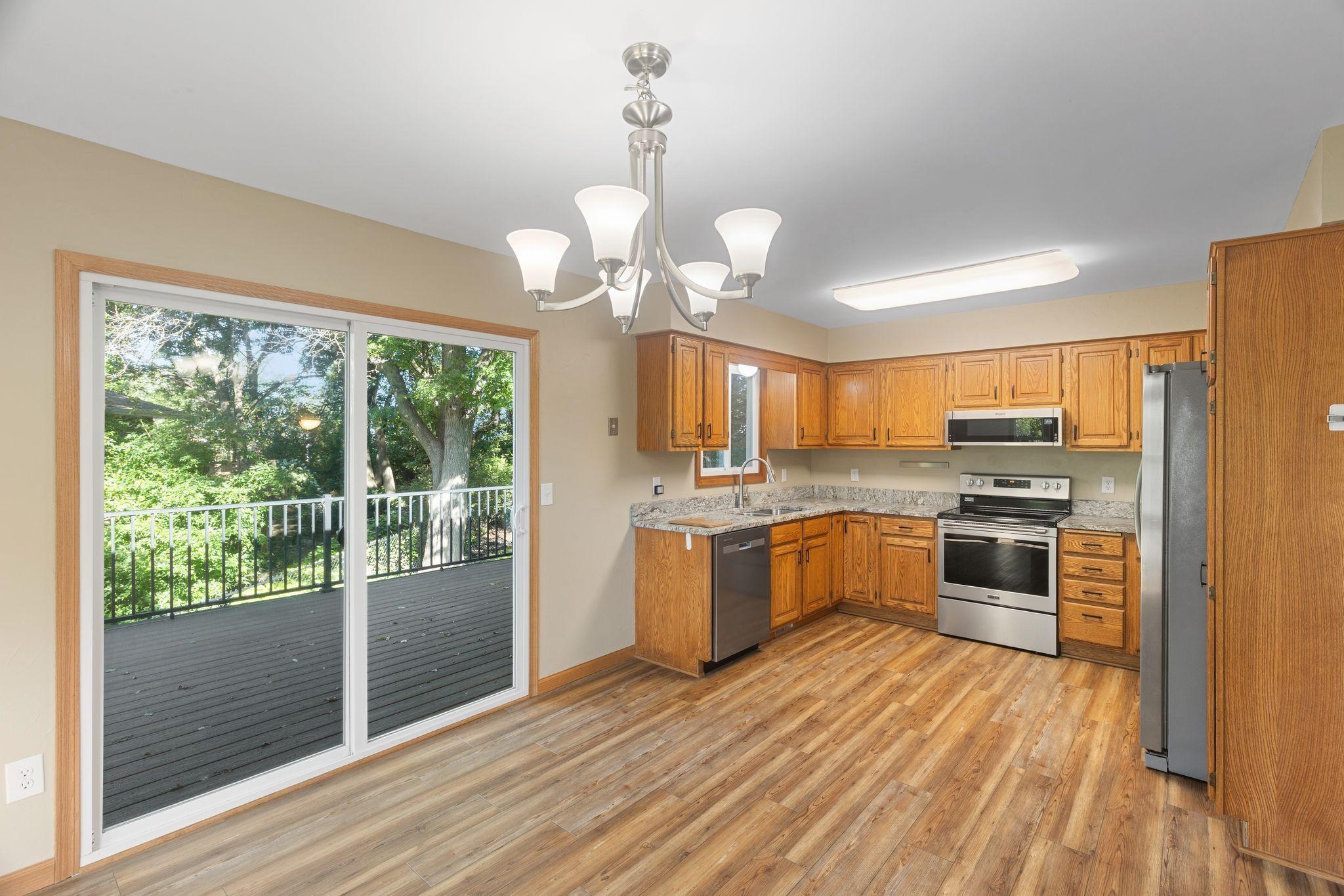 Open kitchen with stainless steel appliances.