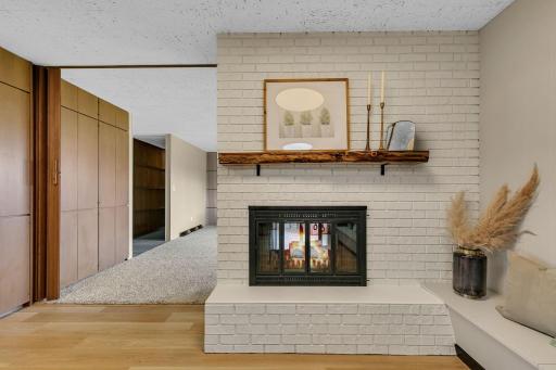 Double-sided fireplace adds warmth and charm to multiple living spaces.