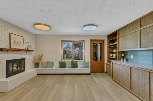 Thoughtfully designed space offers endless possibilities. The two sided fireplace makes this a excellent dining room.