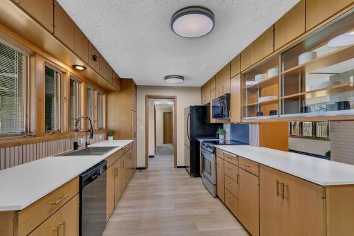Plenty of counter top space to prep all your meals. Stone counters perfectly accent the warm wood tones.