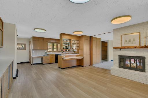Updates throughout the home include flooring, lighting, and paint. Note the floor to ceiling storage that allows for living room access as well.