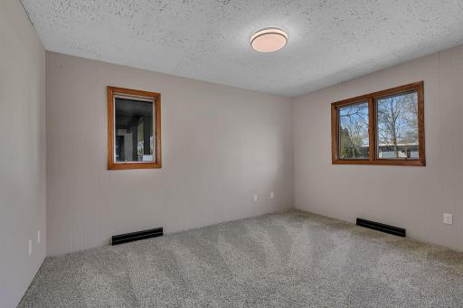 Well-sized bedroom ready for furnishing and personalization. This room has a vantage point to the front porch and front yard.