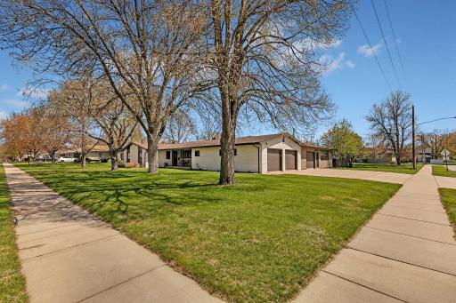 Mature trees shade the lot during the hot summer months. Corner lot with access to sidewalks. School is in walking distance.