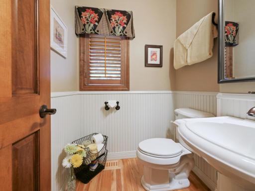 Main floor half bath is convenient to all living spaces.