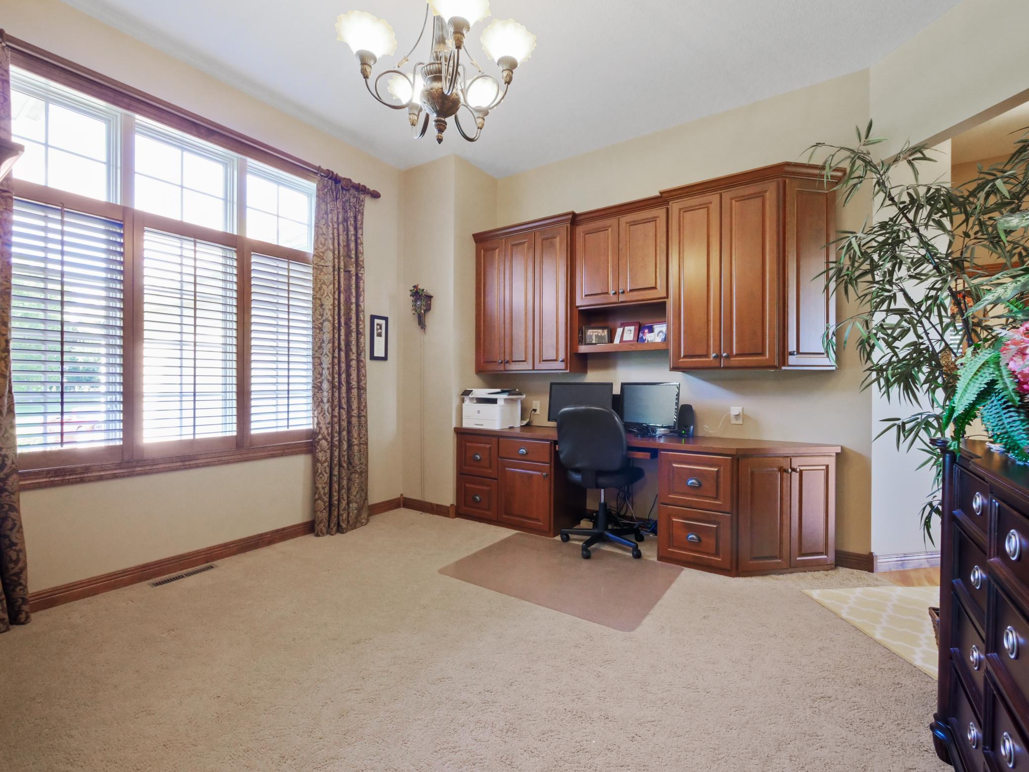 Conveniently located on the main level is a spacious office space or flex room.