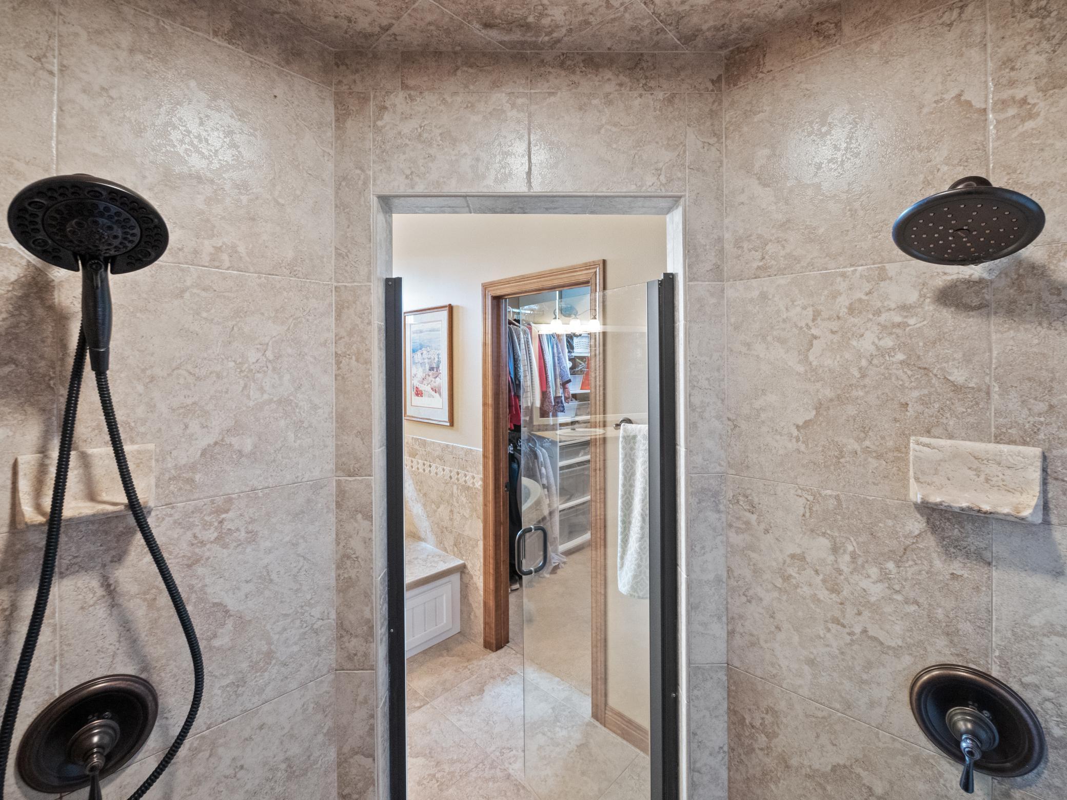 Incredible, spacious shower with two shower heads.