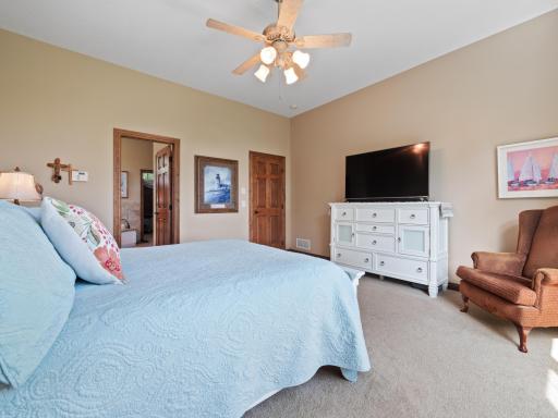 The primary bedroom also offers a walk-in closet and private ensuite.