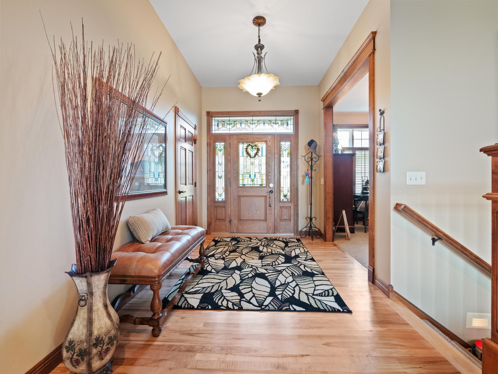 The impressive style of this home begins with gleaming hardwood floors that flow into the kitchen and dining area.