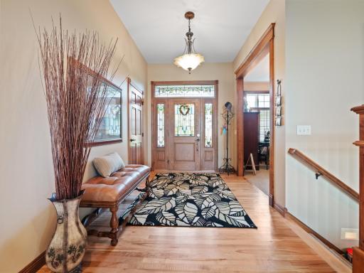 The impressive style of this home begins with gleaming hardwood floors that flow into the kitchen and dining area.
