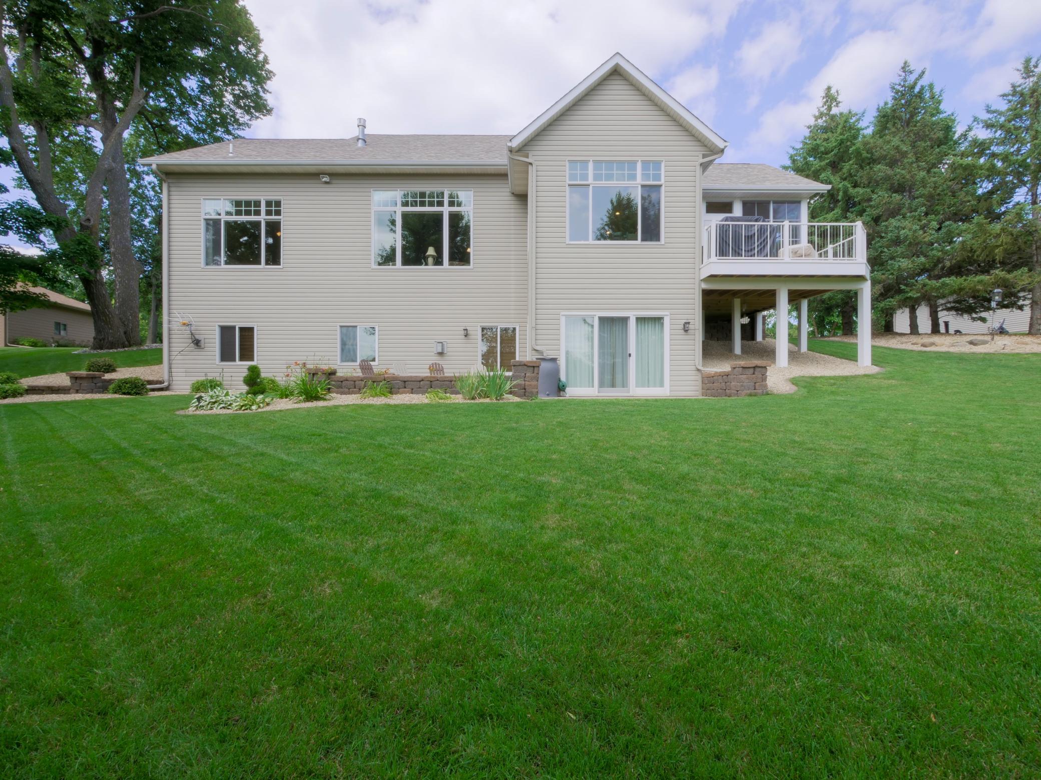 Enjoy a manicured lawn with tons of lush greenery.