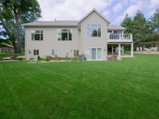 Enjoy a manicured lawn with tons of lush greenery.