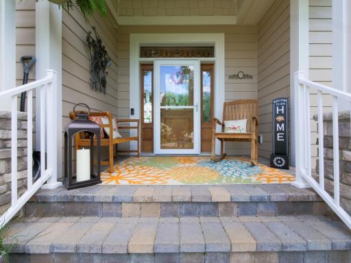 Expansive front porch immediately welcomes friends and family.