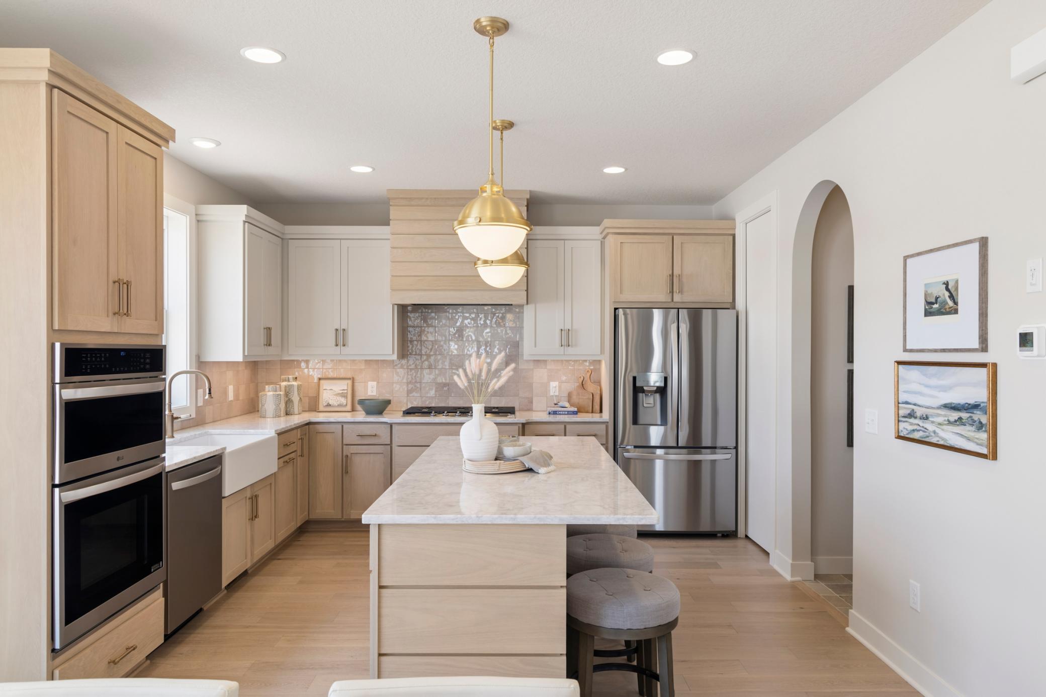 Kitchen also includes wall oven and wall microwave plus walk-in pantry with pocket door.